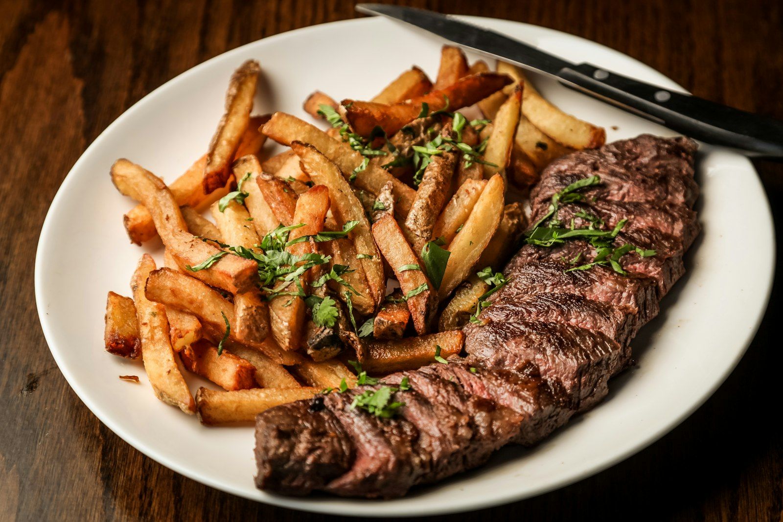 Sliced steak with herbed potatoes